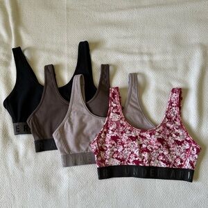 Under Armour bras, size small, black, gray, fuchsia.